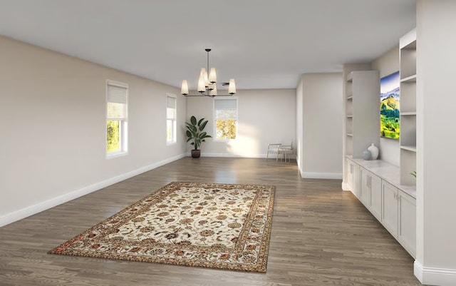 unfurnished dining area with baseboards, an inviting chandelier, dark wood-style floors, and built in shelves