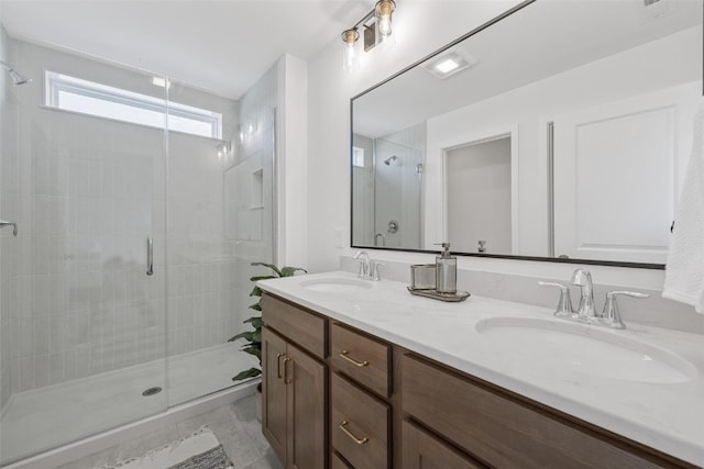 bathroom featuring vanity and walk in shower