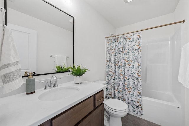 full bathroom featuring vanity, shower / bath combo with shower curtain, and toilet