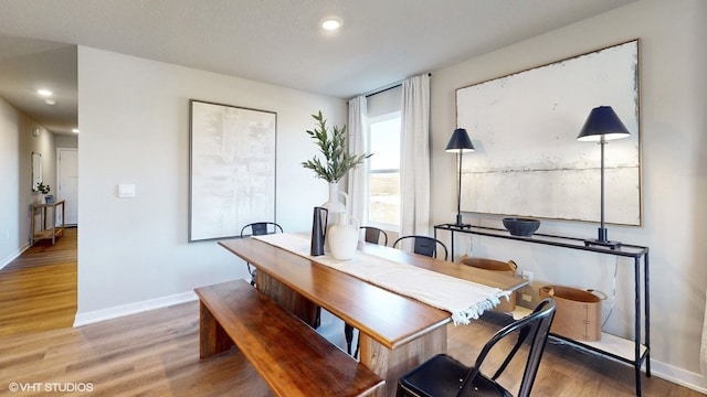 dining area with wood-type flooring