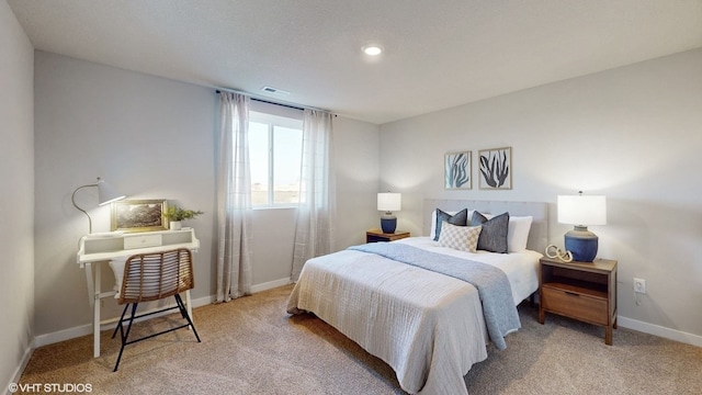 bedroom featuring light colored carpet