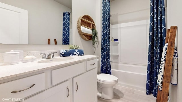 608 Maddie Ln, Tiffin, IA 52340 - full bath with wood finished floors, toilet, vanity, and shower / bathtub combination with curtain