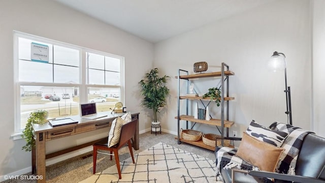608 Maddie Ln, Tiffin, IA 52340 - office area featuring baseboards and light carpet