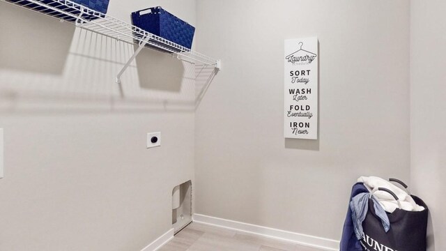 clothes washing area featuring hookup for an electric dryer