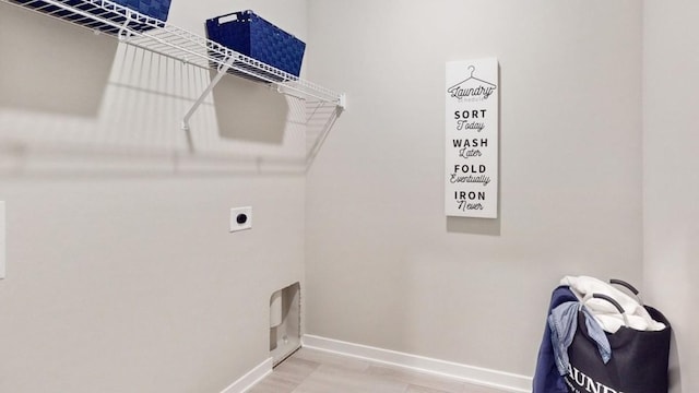 608 Maddie Ln, Tiffin, IA 52340 - clothes washing area with baseboards, hookup for an electric dryer, wood finished floors, and laundry area