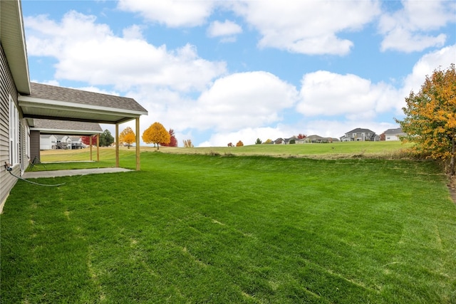 view of yard featuring a carport