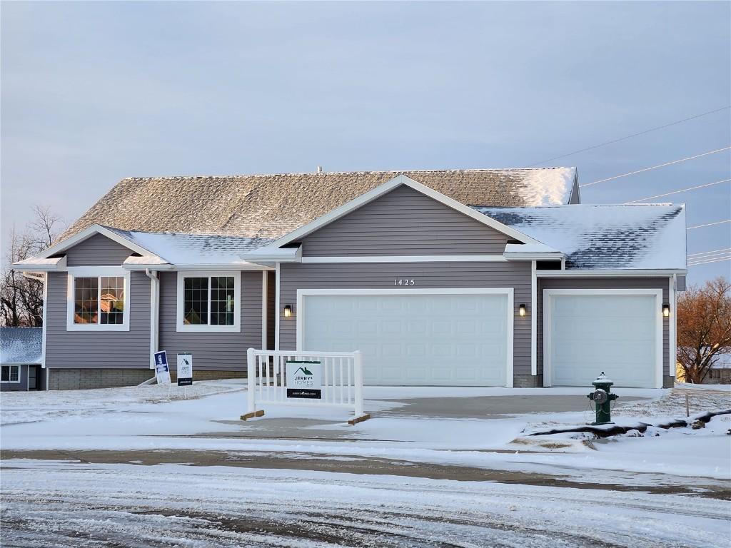 ranch-style home with a garage