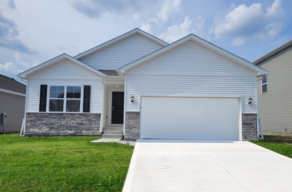 view of front of house with a front yard and a garage