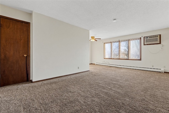 empty room featuring carpet flooring, ceiling fan, a textured ceiling, and baseboard heating