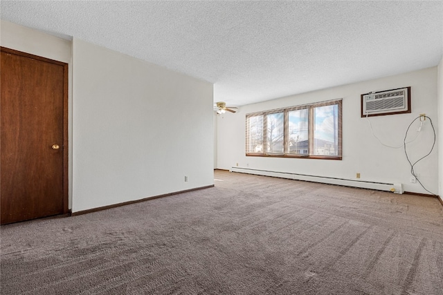 empty room with light carpet, a textured ceiling, a baseboard radiator, and an AC wall unit