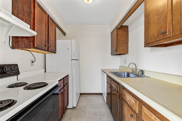 kitchen featuring light tile floors, white appliances, a textured ceiling, and sink