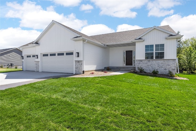 view of front of house featuring a garage and a front lawn