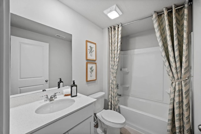 bathroom with visible vents, toilet, vanity, and shower / tub combo