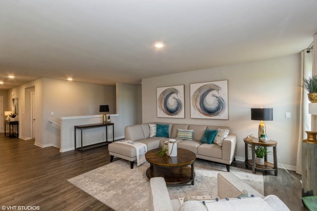 living area featuring recessed lighting, baseboards, and wood finished floors