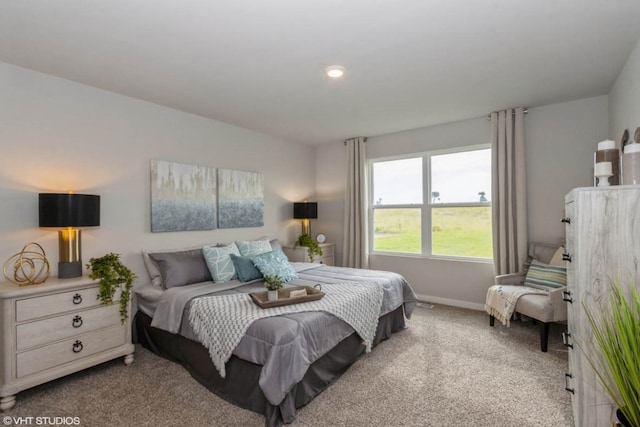carpeted bedroom featuring recessed lighting and baseboards