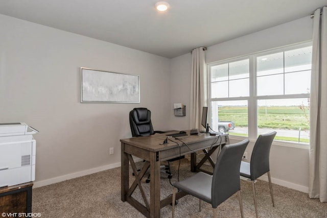 office featuring light carpet and baseboards