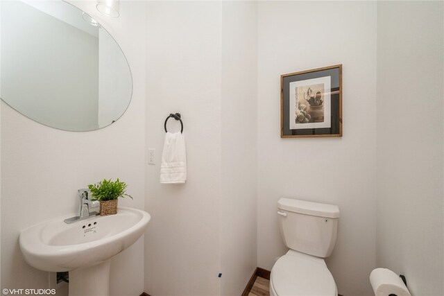 bathroom with toilet and sink