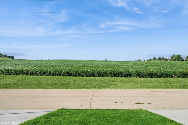 exterior space with a rural view and a yard