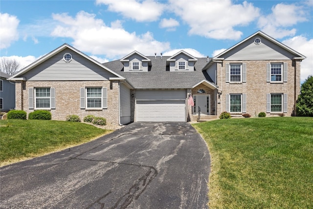 view of front of property featuring a garage and a front yard