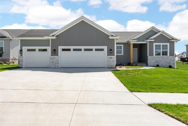 view of front facade with a garage and a front lawn