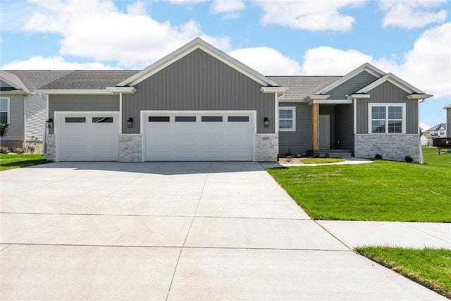 view of front of house with a garage, a front lawn, board and batten siding, and concrete driveway