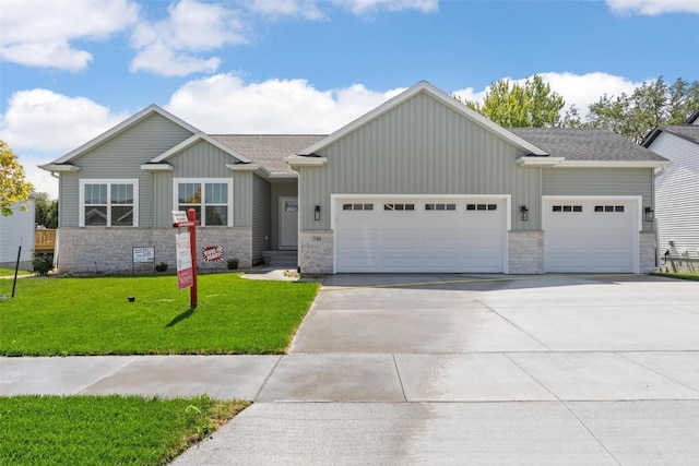 view of front of house featuring a garage and a front lawn