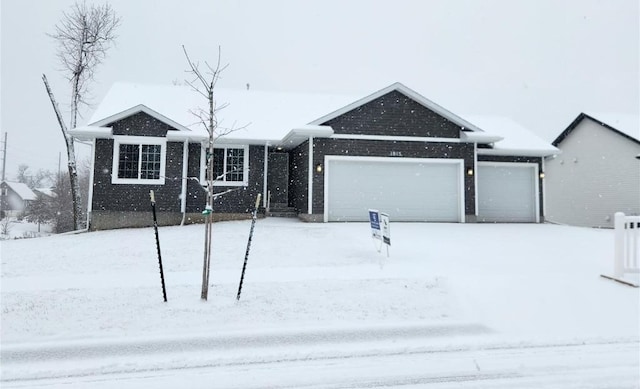 ranch-style house featuring a garage