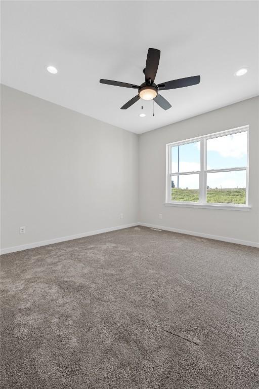 unfurnished room featuring carpet floors, recessed lighting, and baseboards