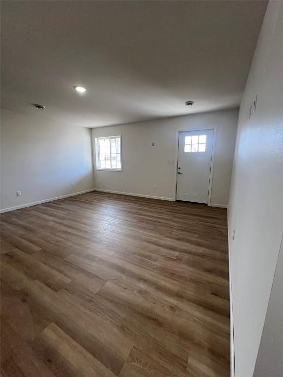 entryway featuring wood finished floors and baseboards