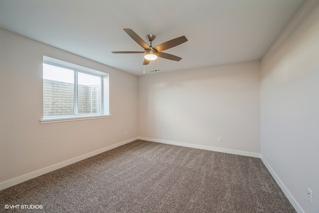 unfurnished room featuring ceiling fan and carpet flooring