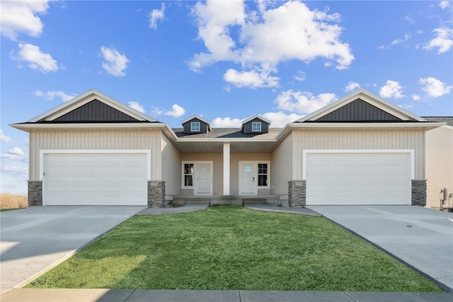 craftsman inspired home with a front yard and a garage