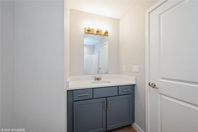 bathroom featuring vanity and hardwood / wood-style floors