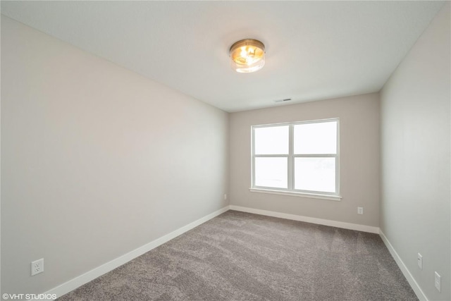 unfurnished room featuring carpet