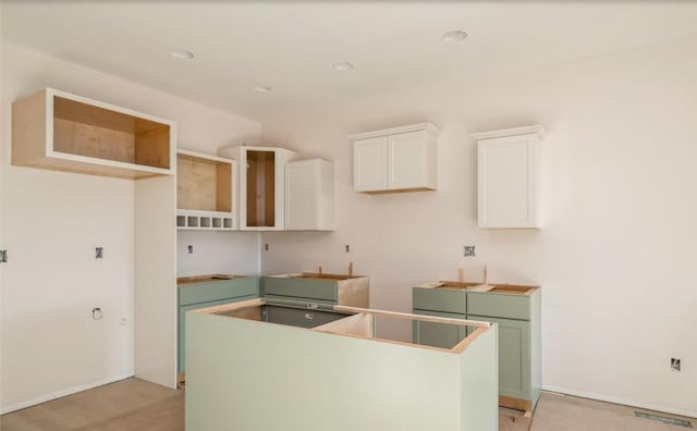 kitchen featuring white cabinetry and a kitchen island