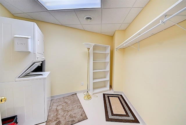 laundry room featuring stacked washer and clothes dryer