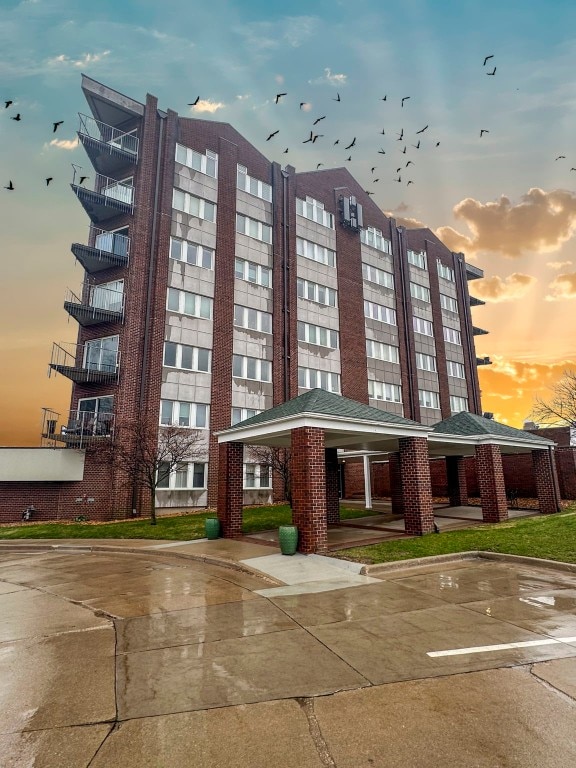 view of outdoor building at dusk