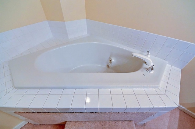 bathroom featuring a relaxing tiled tub