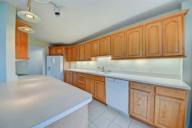 kitchen featuring white appliances, sink, pendant lighting, track lighting, and light tile patterned floors