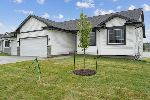 single story home with a front lawn and a garage