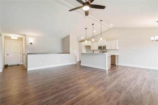 unfurnished living room featuring dark hardwood / wood-style floors, ceiling fan, and lofted ceiling