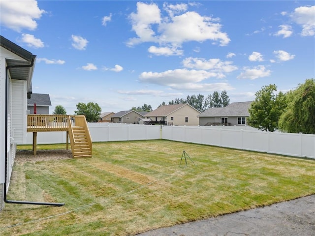 view of yard featuring a wooden deck