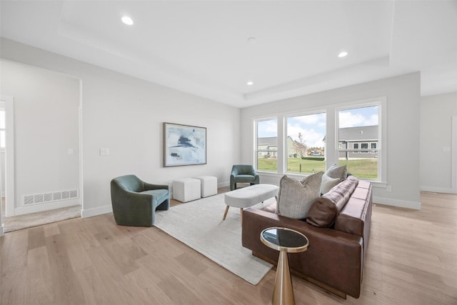 living room with light hardwood / wood-style flooring