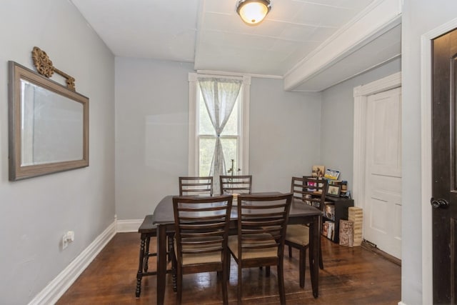 dining space with dark wood-type flooring