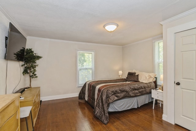 bedroom with dark hardwood / wood-style flooring and crown molding