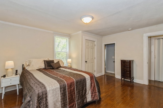 bedroom featuring ornamental molding and dark wood-type flooring