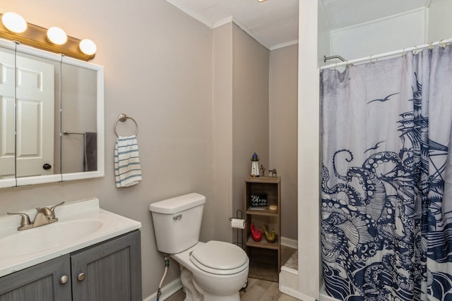 bathroom featuring crown molding, toilet, oversized vanity, and hardwood / wood-style floors