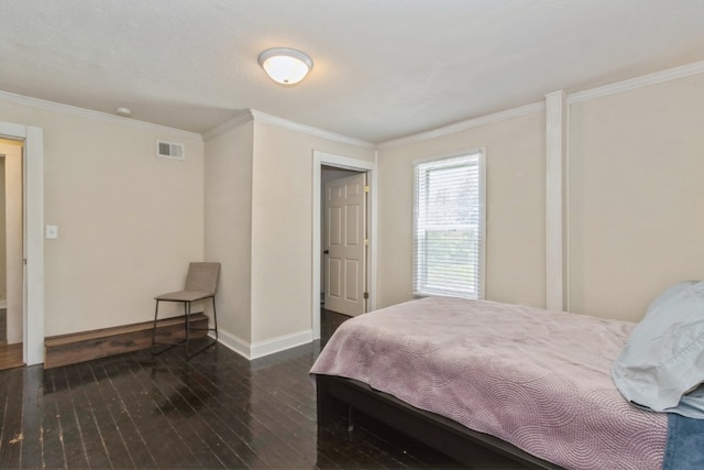 bedroom with ornamental molding and dark hardwood / wood-style flooring