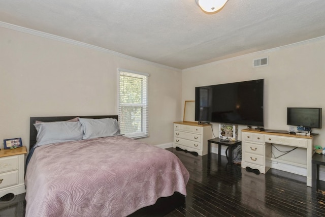 bedroom featuring dark hardwood / wood-style floors, crown molding, and a textured ceiling