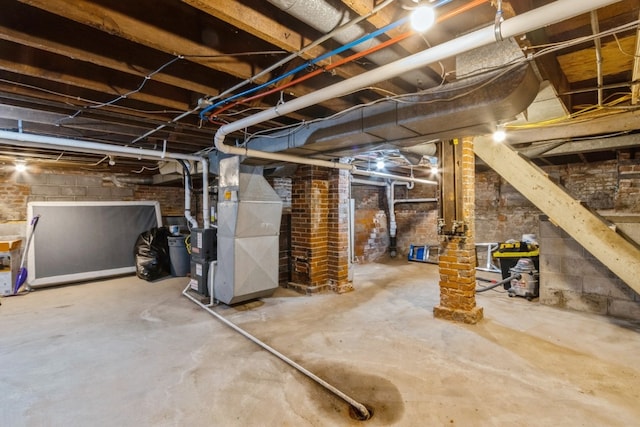 basement with brick wall