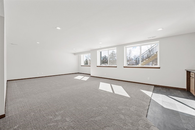 2733 Brookfield Dr, Marion, IA 52302 - unfurnished living room featuring carpet flooring, baseboards, and recessed lighting